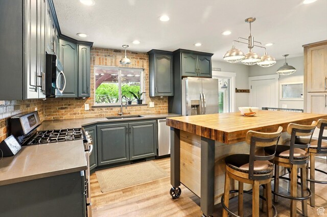 569 N 700 E, Mapleton, UT 84664 - kitchen featuring a sink, stainless steel appliances, tasteful backsplash, butcher block counters, and recessed lighting