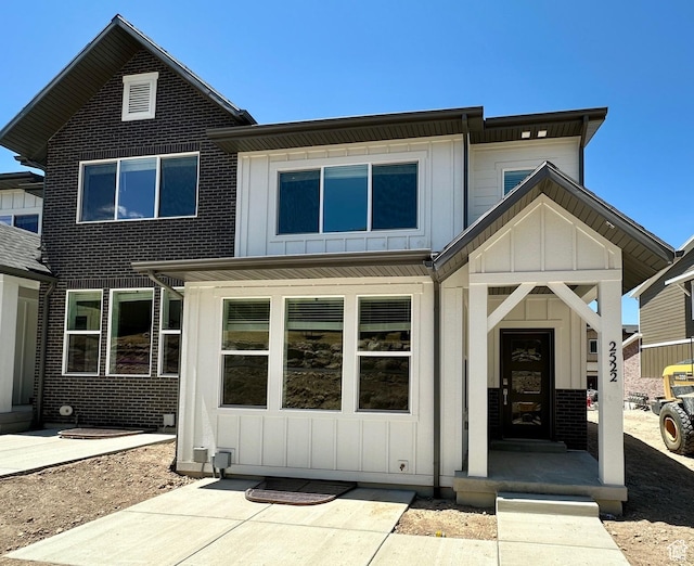 2522 N Wildwood Ln E Unit 240, Heber City, UT 84032 - rear view of property featuring board and batten siding and brick siding