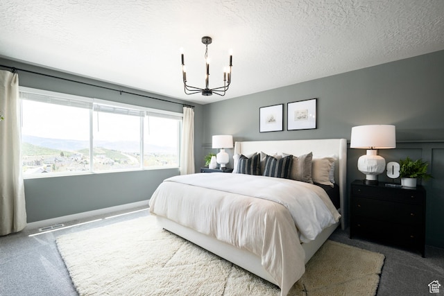 2522 N Wildwood Ln E Unit 240, Heber City, UT 84032 - bedroom featuring carpet flooring, a chandelier, and a textured ceiling