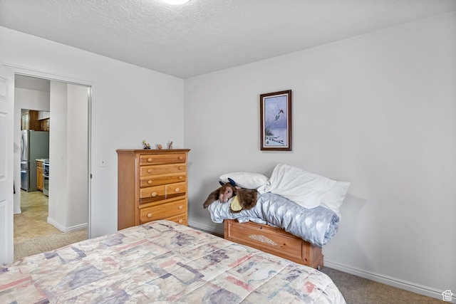 235 W 1000 N, Bountiful, UT 84010 - carpeted bedroom with freestanding refrigerator, a textured ceiling, and baseboards