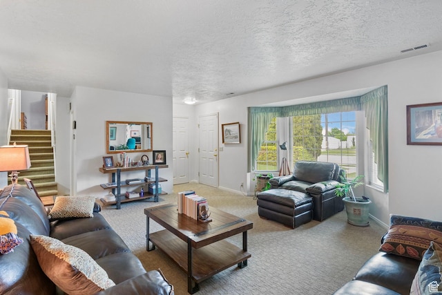 235 W 1000 N, Bountiful, UT 84010 - carpeted living room with a textured ceiling, visible vents, baseboards, and stairway