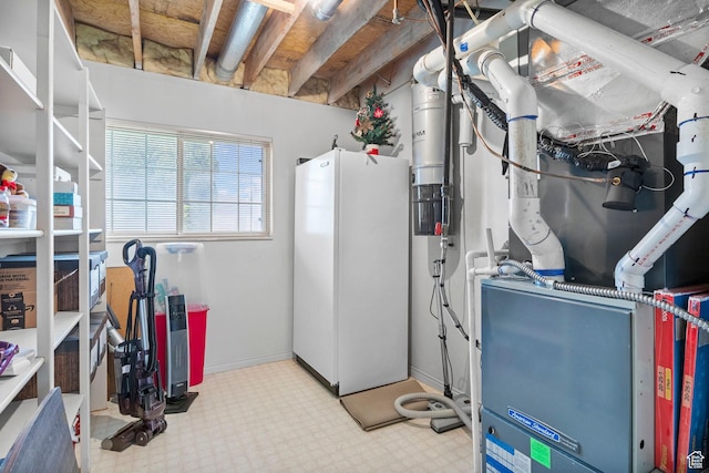 235 W 1000 N, Bountiful, UT 84010 - basement featuring freestanding refrigerator, tile patterned floors, and heating unit