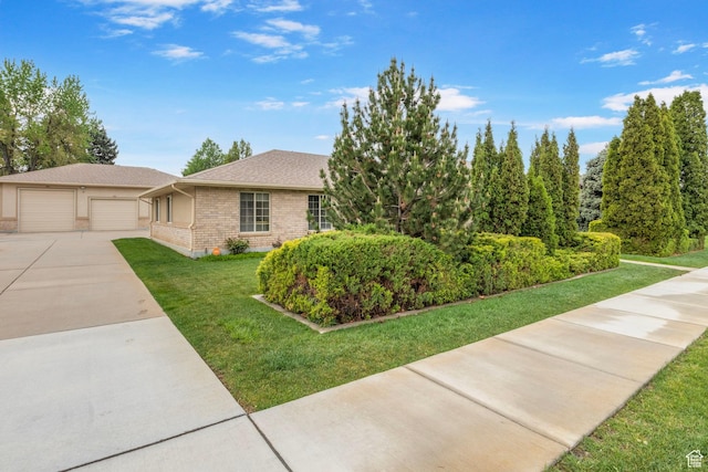 235 W 1000 N, Bountiful, UT 84010 - view of front of property featuring roof with shingles, a garage, brick siding, and a front yard