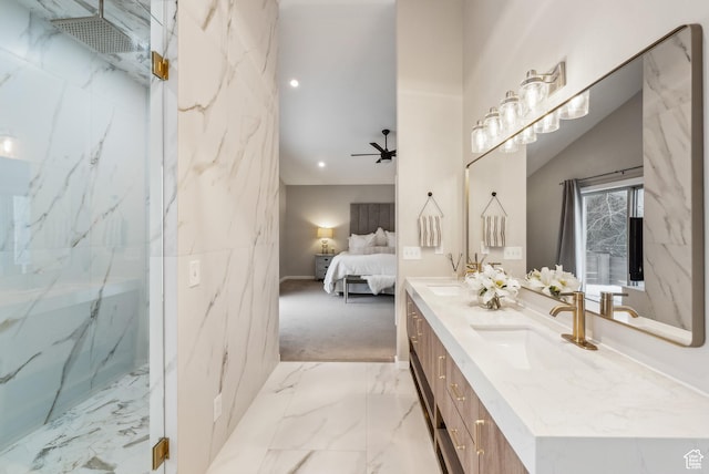 ensuite bathroom with a ceiling fan, ensuite bath, a sink, double vanity, and a marble finish shower