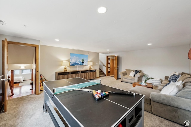 rec room with visible vents, recessed lighting, and light colored carpet