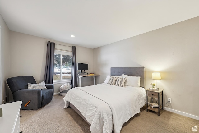 bedroom featuring light carpet, baseboards, and recessed lighting