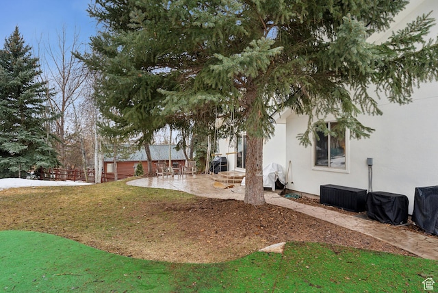 view of yard featuring a patio area and fence