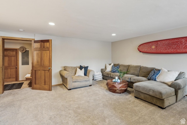 carpeted living area with recessed lighting and electric panel