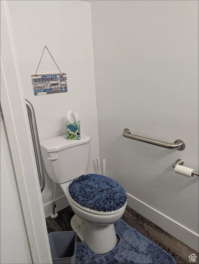 621 Shay Ln, Tooele, UT 84074 - bathroom with toilet, baseboards, and wood finished floors