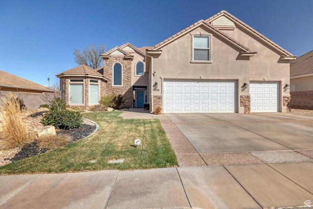 1056 W 100 N, St George, UT 84770 - traditional-style house with stone siding, a garage, stucco siding, a front lawn, and driveway