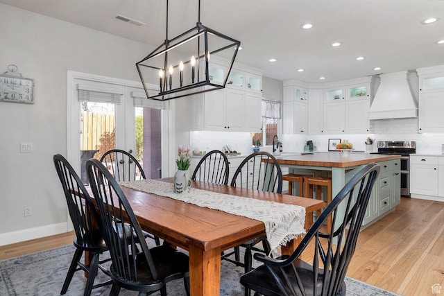 1056 W 100 N, St George, UT 84770 - dining area with visible vents, recessed lighting, a chandelier, light wood finished floors, and baseboards
