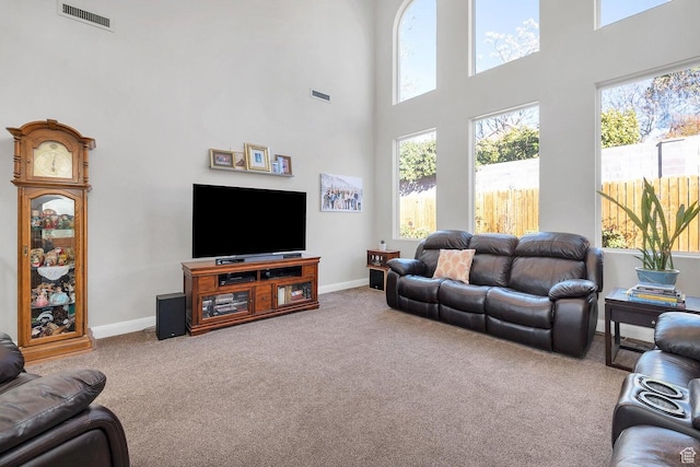 1056 W 100 N, St George, UT 84770 - living area featuring carpet flooring, visible vents, and a towering ceiling