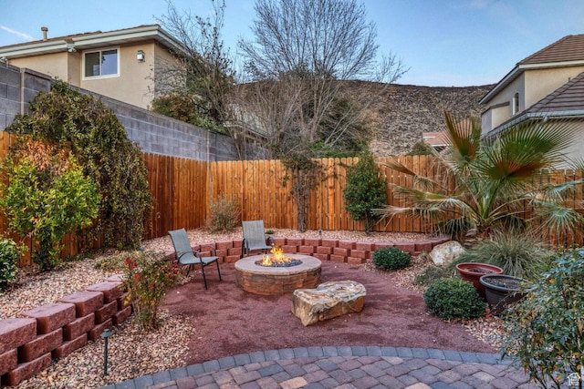 1056 W 100 N, St George, UT 84770 - view of patio / terrace with an outdoor fire pit and a fenced backyard
