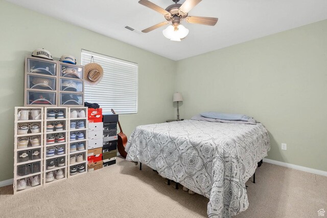 1056 W 100 N, St George, UT 84770 - bedroom featuring baseboards, ceiling fan, visible vents, and carpet floors