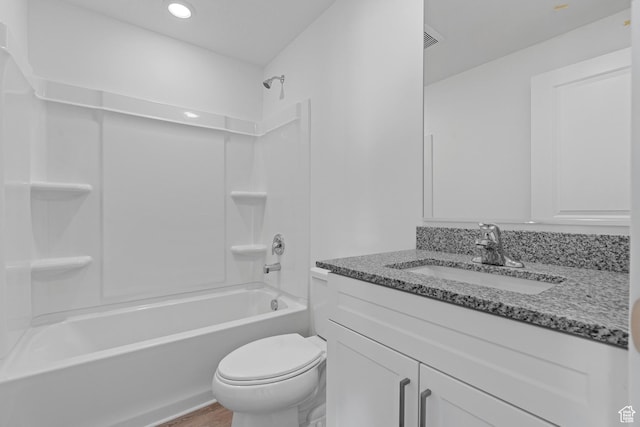 bathroom with toilet, wood finished floors, shower / bath combination, vanity, and recessed lighting