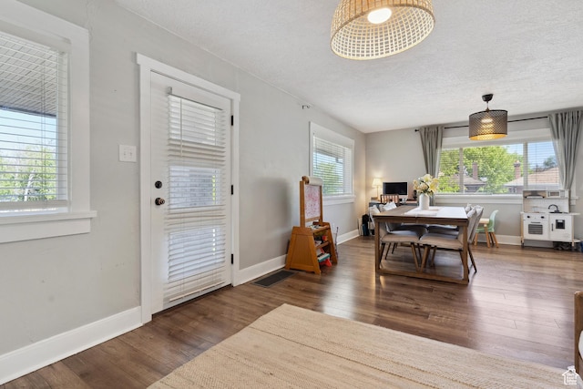 1923 S 600 E, Salt Lake City, UT 84105 - dining room featuring baseboards, visible vents, a textured ceiling, and wood finished floors