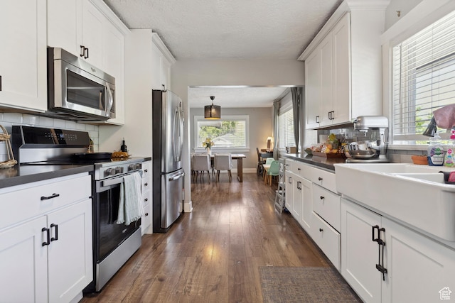 1923 S 600 E, Salt Lake City, UT 84105 - kitchen featuring stainless steel appliances, tasteful backsplash, and dark countertops