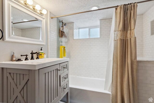 1923 S 600 E, Salt Lake City, UT 84105 - bathroom featuring a textured ceiling, shower / tub combo with curtain, and vanity