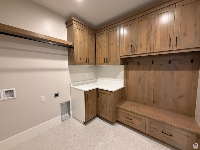 laundry area featuring cabinet space, washer hookup, baseboards, and hookup for an electric dryer
