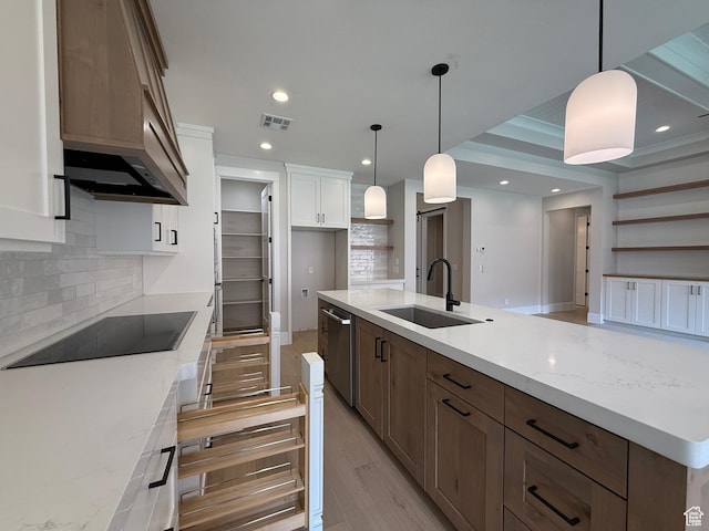 kitchen featuring a sink, black electric stovetop, visible vents, dishwasher, and backsplash