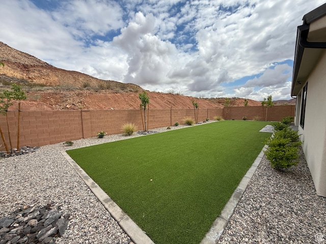 view of yard with a fenced backyard