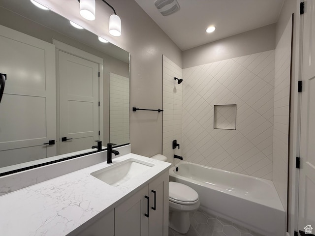 full bathroom featuring toilet, shower / washtub combination, tile patterned floors, visible vents, and vanity
