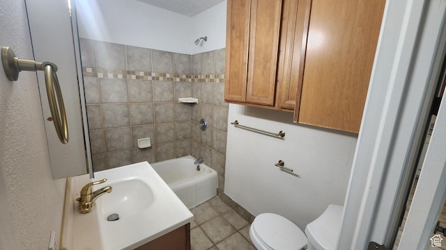 bathroom with toilet, tile patterned floors, vanity, and shower / washtub combination