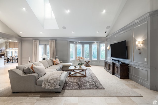 680 S Davis Blvd, Bountiful, UT 84010 - living room featuring a wealth of natural light, a decorative wall, and high vaulted ceiling