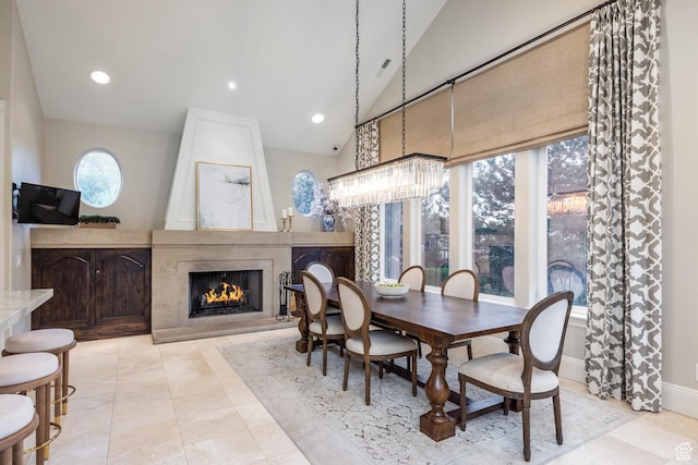 680 S Davis Blvd, Bountiful, UT 84010 - dining room featuring lofted ceiling, tile patterned floors, recessed lighting, a large fireplace, and baseboards