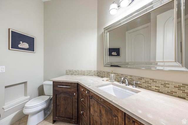680 S Davis Blvd, Bountiful, UT 84010 - half bathroom with toilet, tasteful backsplash, vanity, and tile patterned flooring