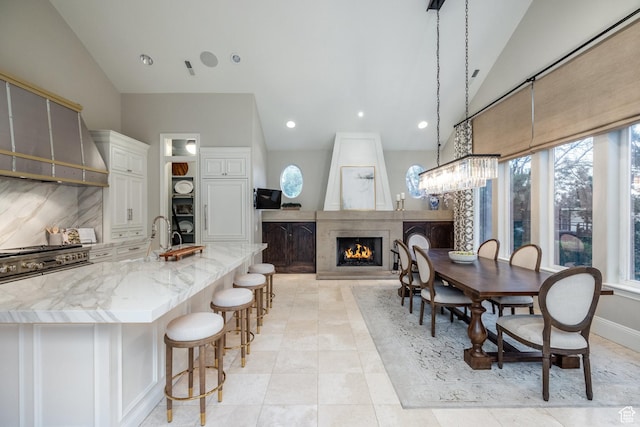 680 S Davis Blvd, Bountiful, UT 84010 - dining space featuring lofted ceiling, recessed lighting, and a large fireplace