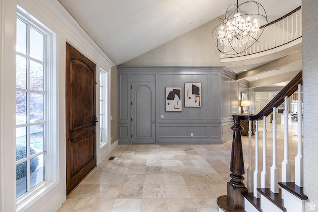 680 S Davis Blvd, Bountiful, UT 84010 - entryway with a decorative wall, a chandelier, plenty of natural light, and vaulted ceiling