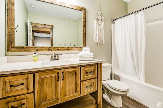 2869 S Chukar Dr Unit 63, Garden City, UT 84028 - full bath featuring toilet, shower / bath combo, wood finished floors, and vanity