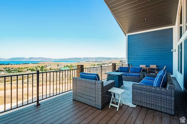 2869 S Chukar Dr Unit 63, Garden City, UT 84028 - wooden terrace featuring outdoor lounge area and a mountain view