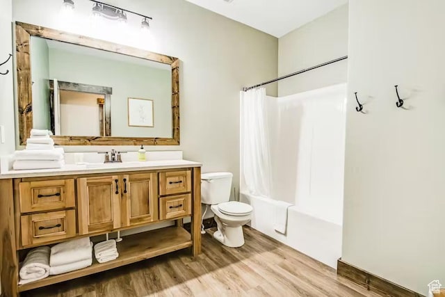 2869 S Chukar Dr Unit 63, Garden City, UT 84028 - full bathroom with toilet, shower / tub combo with curtain, vanity, and wood finished floors