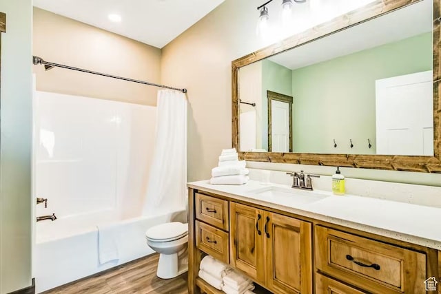2869 S Chukar Dr Unit 63, Garden City, UT 84028 - full bathroom with vanity, toilet, shower / bath combo, and wood finished floors
