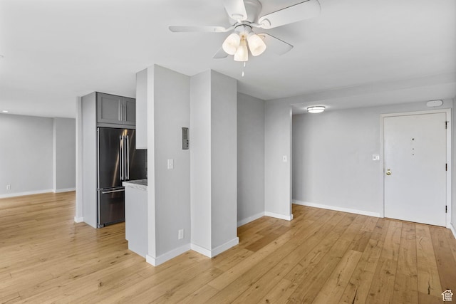 777 E S Temple S Unit 11B, Salt Lake City, UT 84102 - unfurnished living room with baseboards, light wood finished floors, and ceiling fan