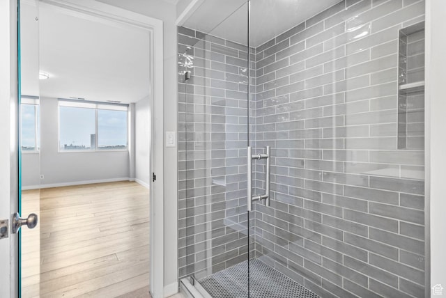 777 E S Temple S Unit 11B, Salt Lake City, UT 84102 - full bathroom with baseboards, wood finished floors, and a stall shower
