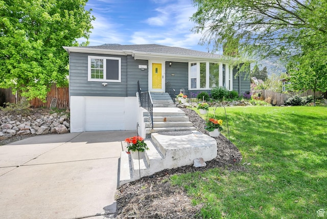 ranch-style house with concrete driveway and a garage