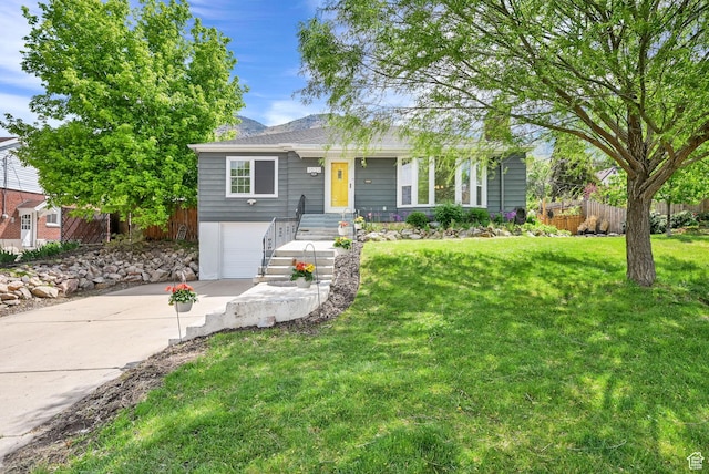single story home with concrete driveway and an attached garage