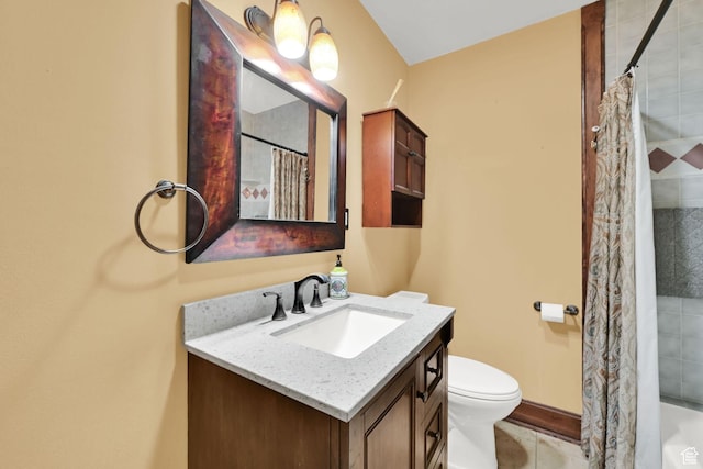 bathroom featuring toilet, vanity, a shower with shower curtain, and tile patterned floors