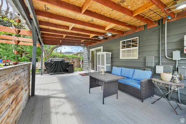 view of patio featuring a deck, an outdoor living space, and area for grilling