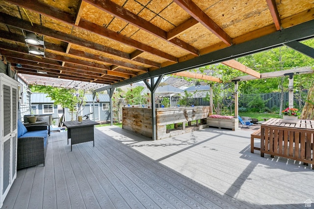 deck featuring a fenced backyard and an outdoor living space