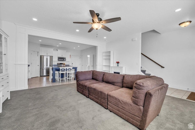 8072 N Rock Creek Cove Ln, Eagle Mountain, UT 84005 - living room with ceiling fan, light carpet, stairs, and recessed lighting