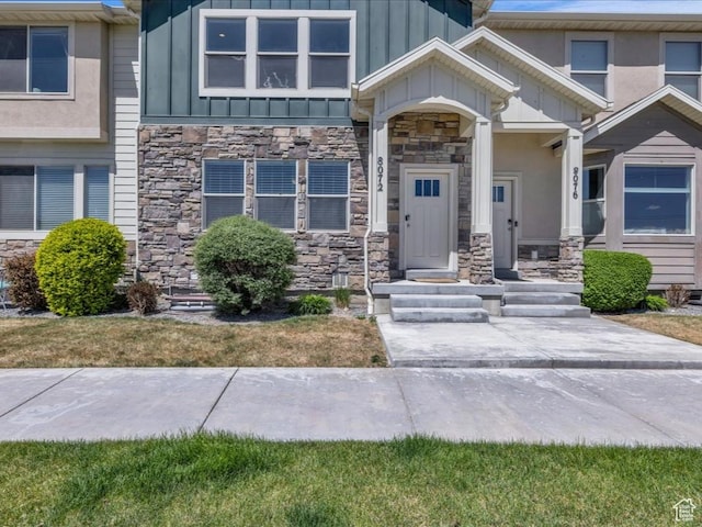 8072 N Rock Creek Cove Ln, Eagle Mountain, UT 84005 - entrance to property with stone siding and board and batten siding