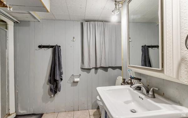 bathroom with tile patterned flooring and a sink