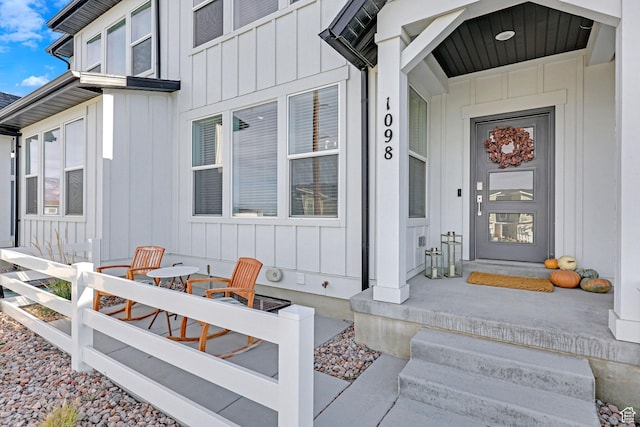 doorway to property with board and batten siding