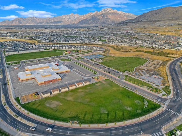 birds eye view of property with a mountain view and a residential view