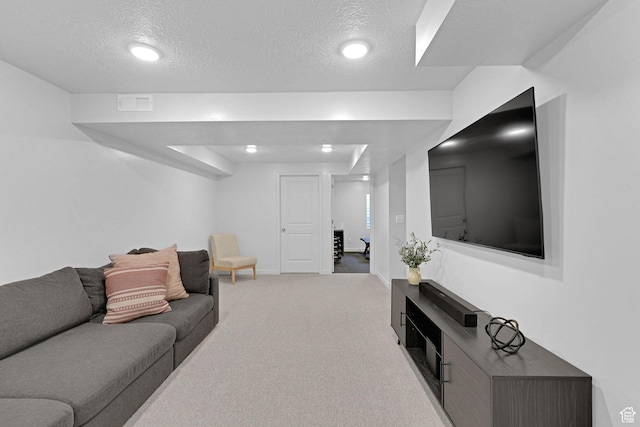 living room with baseboards, carpet flooring, recessed lighting, and a textured ceiling
