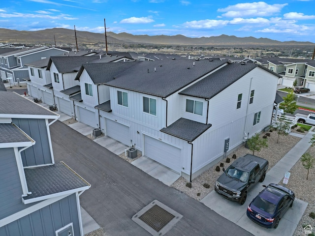 drone / aerial view featuring a mountain view and a residential view